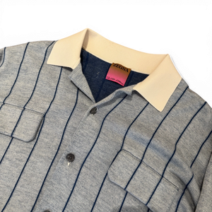 Ākaibu Store light blue and navy striped cashmere knit shirt with cream collar and two chest pockets.