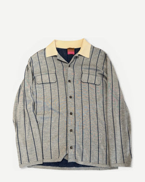 Ākaibu Store light grey cashmere shirt with navy vertical stripes and a cream collar. Features two chest pockets and button closure.